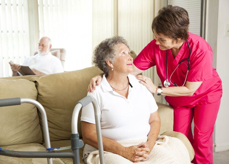 Nurse helping patient in Respite Care