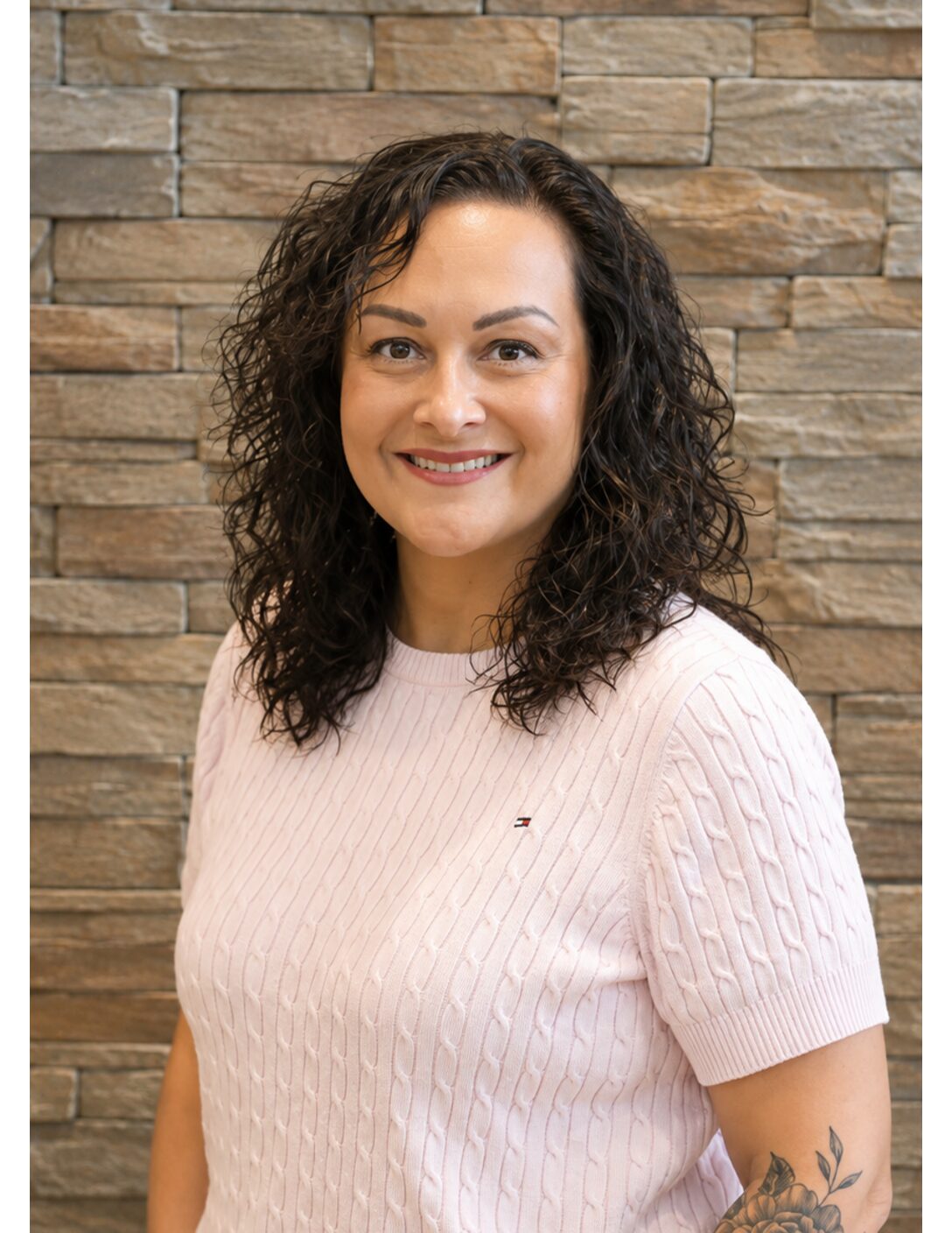 female nurse with brown curly hair